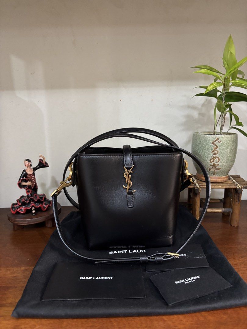 Ysl bucket bag (Category: Luxury Bags & Wallets) located in Quezon City. Submitted by ingridsfinds (Listing ID 1465976909, Image 2). Description: Excellent condition With cards dustbag, Can worn as handbag, shoulder and cross body bag Can fit iphone Small wallet, powerbank.
