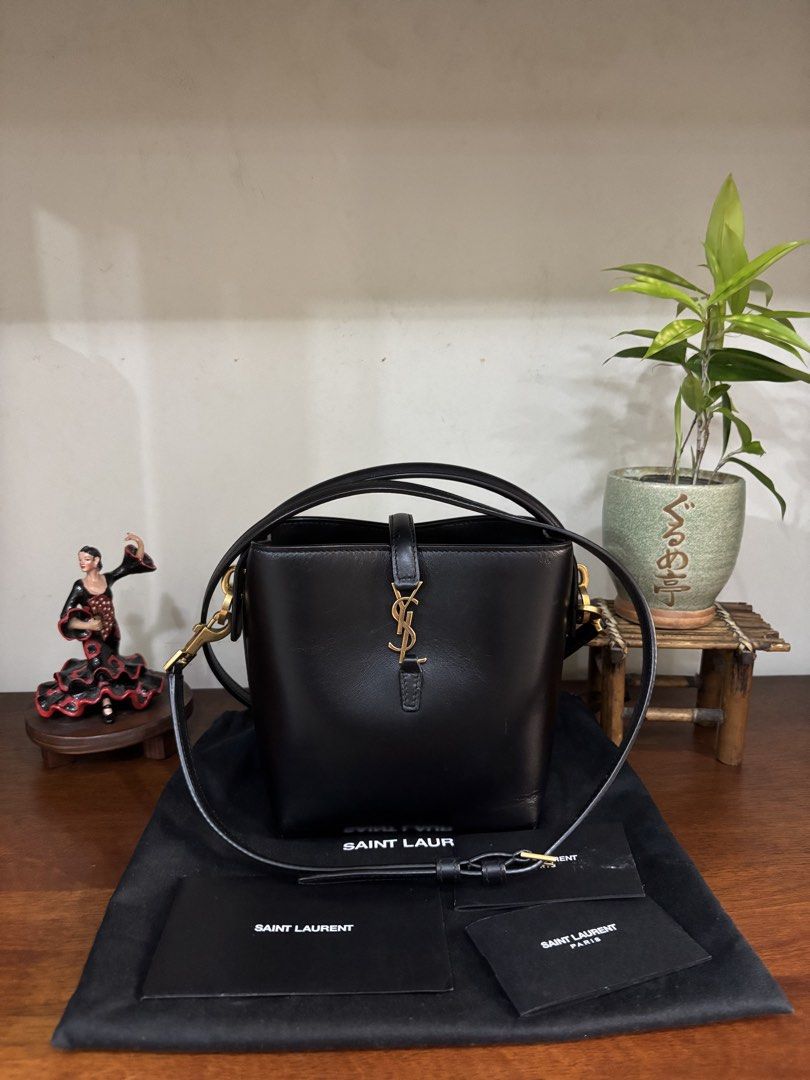 Ysl bucket bag (Category: Luxury Bags & Wallets) located in Quezon City. Submitted by ingridsfinds (Listing ID 1465976909, Image 3). Description: Excellent condition With cards dustbag, Can worn as handbag, shoulder and cross body bag Can fit iphone Small wallet, powerbank.
