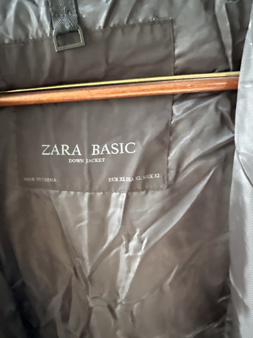 Zara Basic Black Down Puffer Jacket Hooded (Category: Coats, Jackets and Outerwear) located in Quezon City. Submitted by dropdeadprices (Listing ID 1465995457, Image 3). Description: - Brand: Zara Basic - Color: Black - Size: XL (Fits approx. 26" across the chest) - Insulation: 70% down, 30% feathers (super warm) - Features: Built-in hood, secure zippered pockets, ribbed hem and cuffs - Condition: Clean inside and out, all labels intact 22.5 x 35