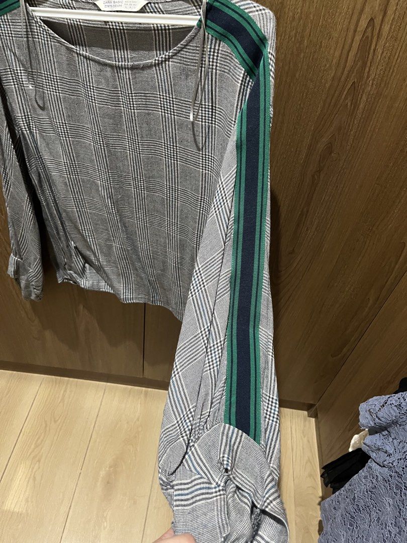 Zara Basic Plaid Long Sleeve Blouse Size XL (Category: Longsleeves) located in Quezon City. Submitted by epictiger.c6451a (Listing ID 1465963862, Image 3). Description: - Brand: Zara Basic - Size: XL - Color: Grey and black plaid with navy and green arm stripes - Design: Long sleeves, rounded neckline, loose fit - Origin: Made in Turkey - Condition/Style: Comfortable casual piece, great for everyday wear.