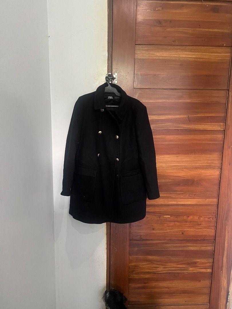 Zara Black Coat Double Breasted Gold Buttons (Category: Coats, Jackets and Outerwear) located in Pasay City. Submitted by sharshay317 (Listing ID 1465998080, Image 2). Description: Zara black coat in size large, made in Morocco. Double-breasted front closure featuring shiny gold-toned buttons. Two front patch pockets at the waist level. Classic collar design and lined interior. Good solid weight for cooler weather. Clean lines and simple silhouet