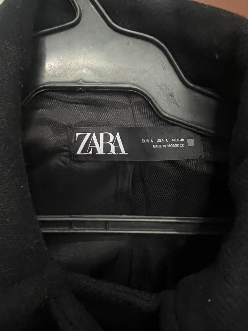 Zara Black Coat Double Breasted Gold Buttons (Category: Coats, Jackets and Outerwear) located in Pasay City. Submitted by sharshay317 (Listing ID 1465998080, Image 3). Description: Zara black coat in size large, made in Morocco. Double-breasted front closure featuring shiny gold-toned buttons. Two front patch pockets at the waist level. Classic collar design and lined interior. Good solid weight for cooler weather. Clean lines and simple silhouet