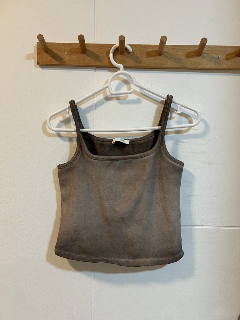 Zara Brown Tank Top (Category: Shirts) located in Manila. Submitted by mcspicybuys (Listing ID 1466119785, Image 1). Description: - Brand: Zara - Color: Brown - Size: EUR/USA L (MEX 30) - Material: Soft cotton with ribbed neckline - Fit: Comfortable and great for daily wear - Versatile: Easy to match with jeans or shorts.