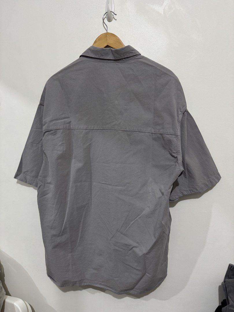 Zara Grey Short Sleeve Button Down Shirt (Category: Formal Shirts) located in Mandaluyong City. Submitted by sale.hm (Listing ID 1466151458, Image 3). Description: Used only once Zara Oversized Short Sleeves Shirt Large size, grey color 23.5in W x 29in L Mandaluyong.