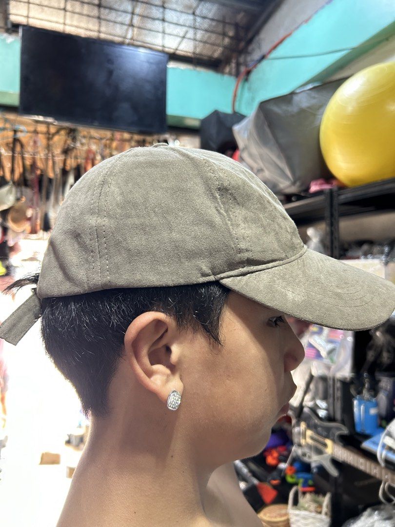 Zara Grey Suede Baseball Cap (Category: Caps & Hats) located in Manila. Submitted by starbalesukandjapansurplus (Listing ID 1465992237, Image 2). Description: - Brand: Zara - Size: EUR S-M - Material: Soft suede-like fabric - Color: Versatile neutral grey (earth tone) - Features: Classic panel construction with topstitching, adjustable back strap with metal slider buckle - Condition: Excellent/Well-maintained - Perfect for everyday casual wear.