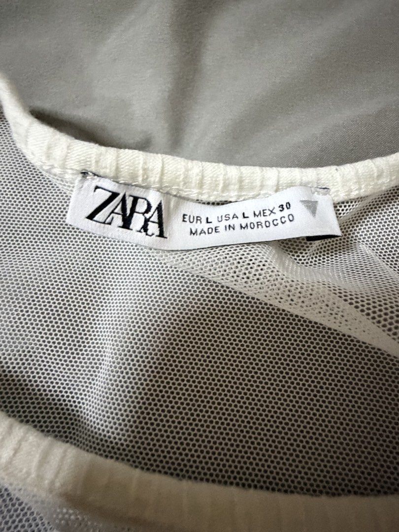 Zara ribbed white bodysuit (Category: Others Tops) located in Quezon City. Submitted by bloompicks (Listing ID 1466021405, Image 2). Description: Used once like new. No issues Stretchy.