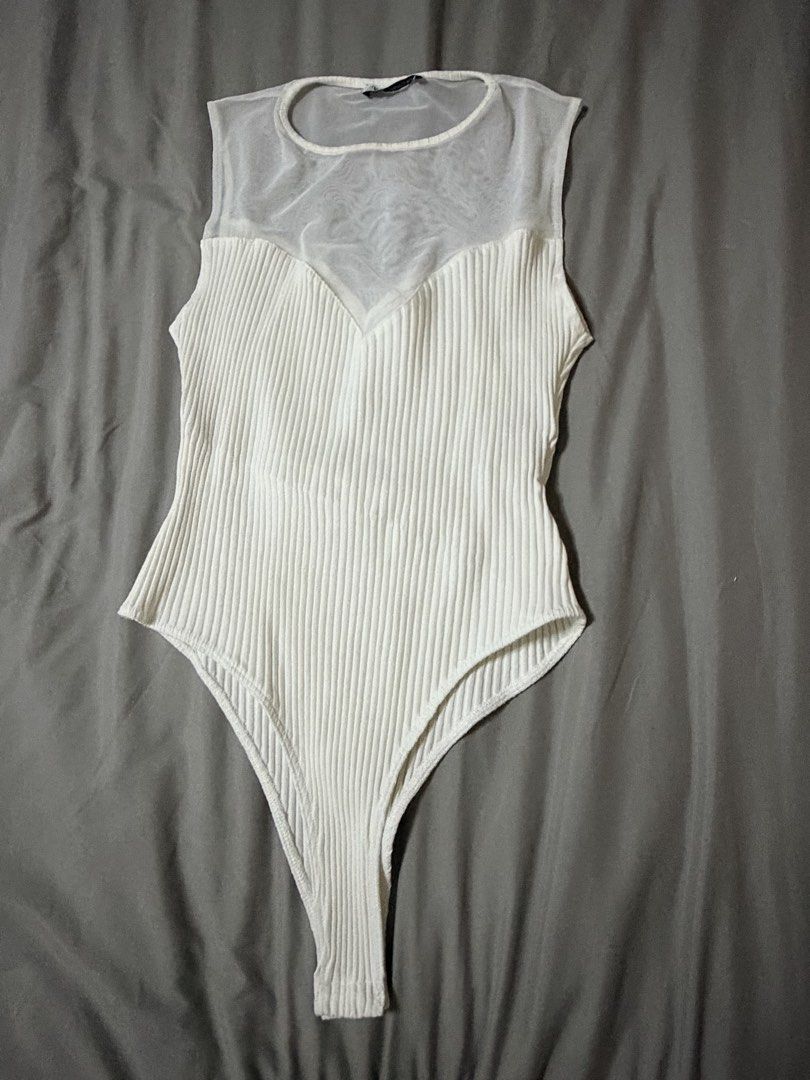 Zara ribbed white bodysuit (Category: Others Tops) located in Quezon City. Submitted by bloompicks (Listing ID 1466021405, Image 1). Description: Used once like new. No issues Stretchy.