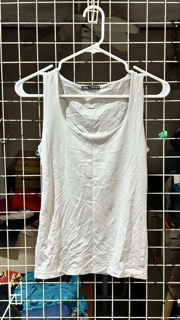 Zara White Tank Top Size S (Category: Sleeveless) located in Quezon City. Submitted by nsseller (Listing ID 1466108947, Image 1). Description: - Brand: Zara - Size: S (EUR, USA, MEX) - Color: White - Material: Standard cotton blend - Origin: Made in Turkey - Design: Scoop neckline, sleeveless - Condition: Excellent, basic wardrobe staple perfect for layering or everyday wear.
