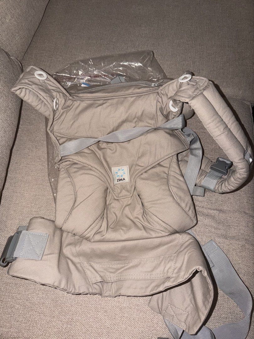 Zima Adjustable Ergonomic Baby Carrier (Category: Carriers & Slings) located in Quezon. Submitted by selenamartinezz (Listing ID 1466072956, Image 2). Description: - Brand: Zima - Color: Versatile neutral gray - Age Range: Supports newborns up to toddlers NEVER USED BOUGHT IN BABY FAIR IN DECEMBER.
