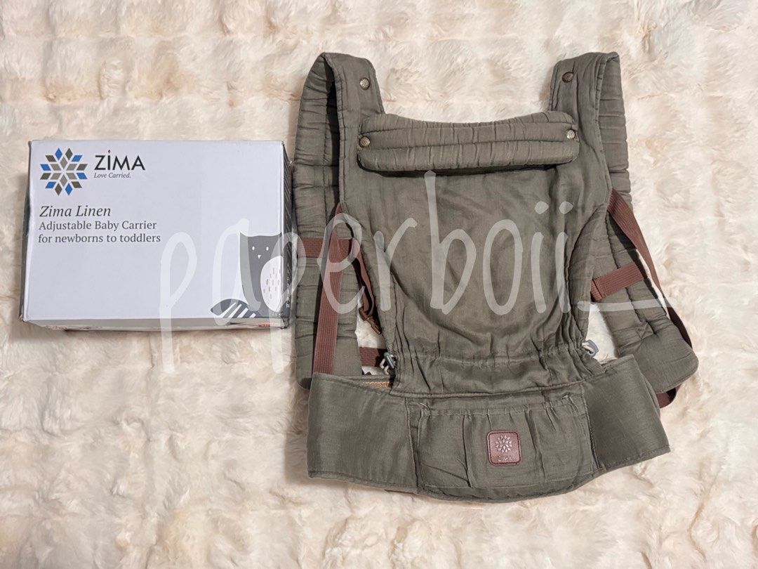 Zima Linen Adjustable Baby Carrier (Category: Carriers & Slings) located in San Juan City. Submitted by paperboii_ (Listing ID 1466092624, Image 1). Description: - Brand: Zima Linen Adjustable Baby Carrier - Color: Taupe - Age Range: Newborns to toddlers - Condition: Includes original storage box .