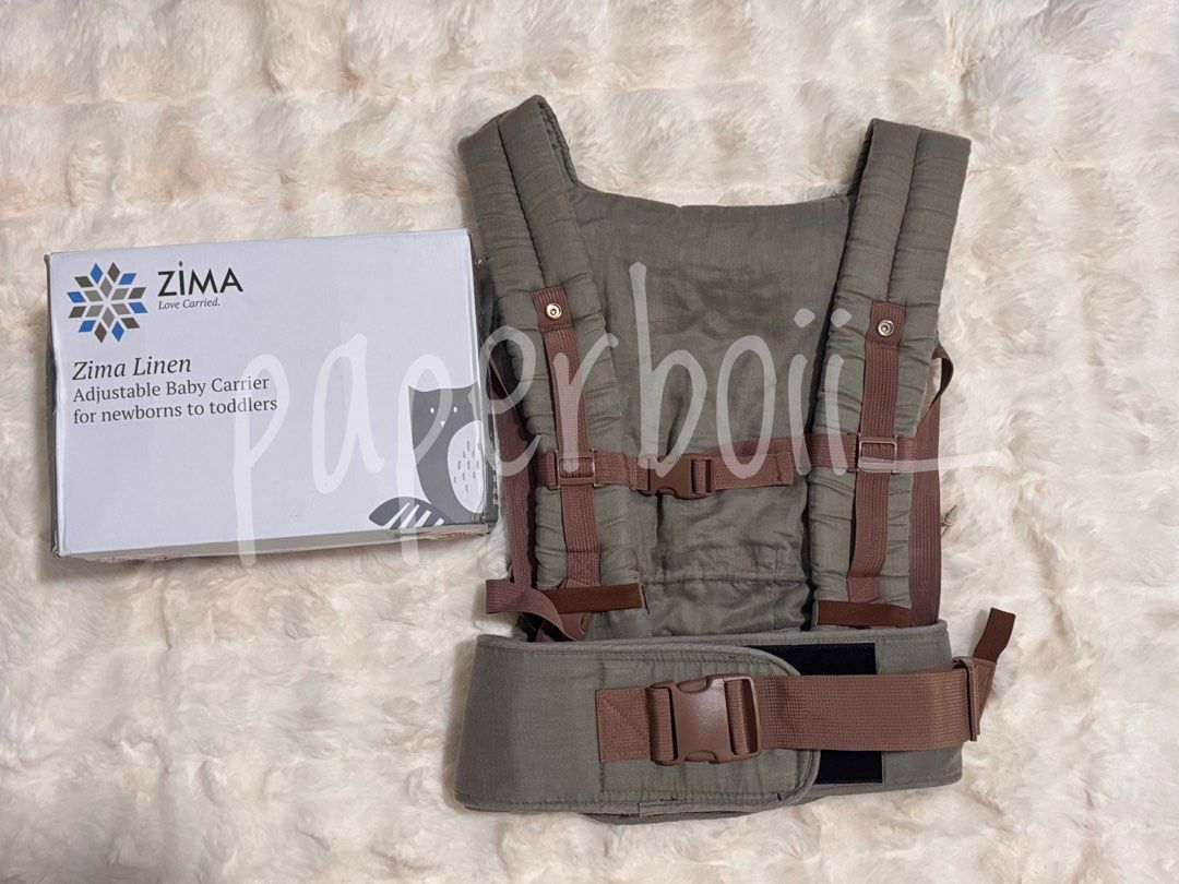 Zima Linen Adjustable Baby Carrier (Category: Carriers & Slings) located in San Juan City. Submitted by paperboii_ (Listing ID 1466092624, Image 2). Description: - Brand: Zima Linen Adjustable Baby Carrier - Color: Taupe - Age Range: Newborns to toddlers - Condition: Includes original storage box .