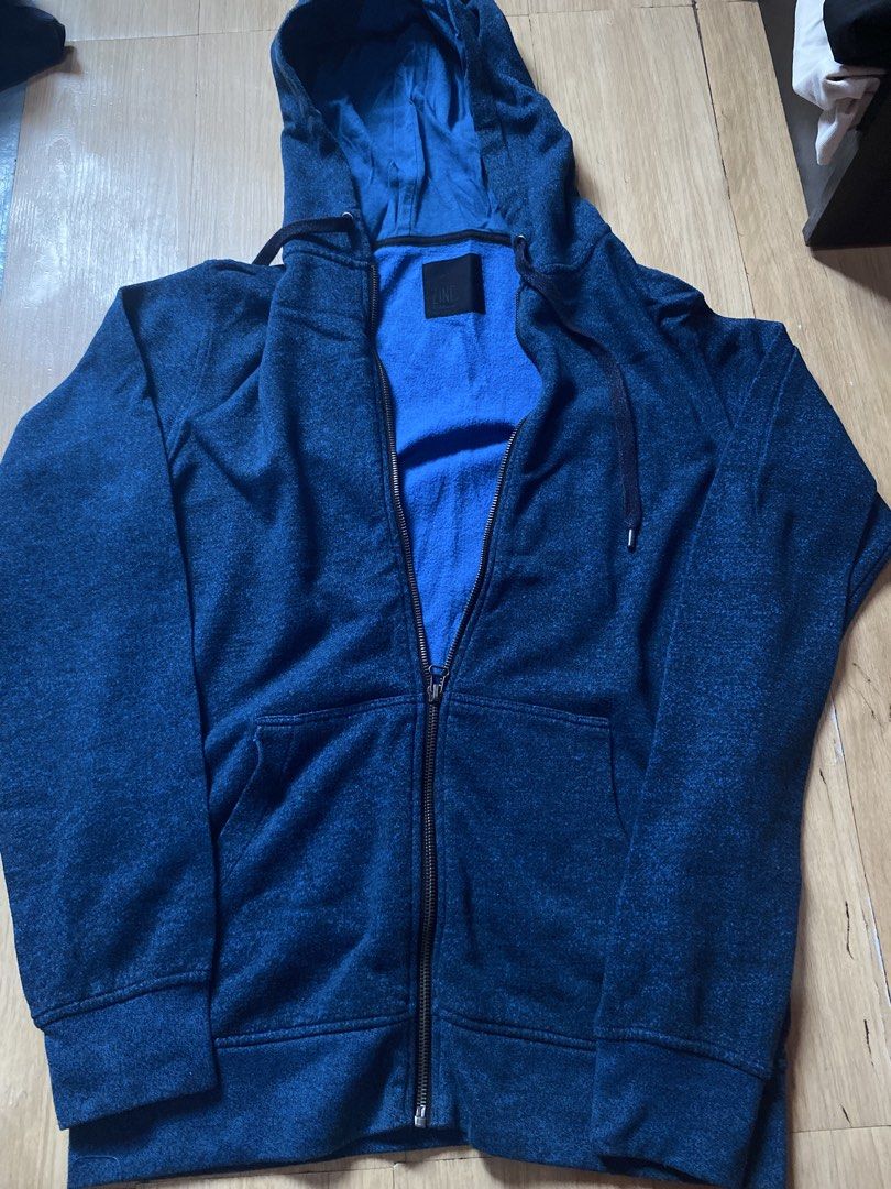 Zine Blue Zip-Up Hoodie (Category: Coats, Jackets and Outerwear) located in Tanauan. Submitted by rie098 (Listing ID 1466041470, Image 2). Description: - Color: Dark blue heather with bright blue interior lining - Closure: Full zipper - Pockets: Front split kangaroo pocket - Details: Contrasting drawstrings, ribbed cuffs and hem - Fit: Standard fit - Ideal for: Cooler weather layering.