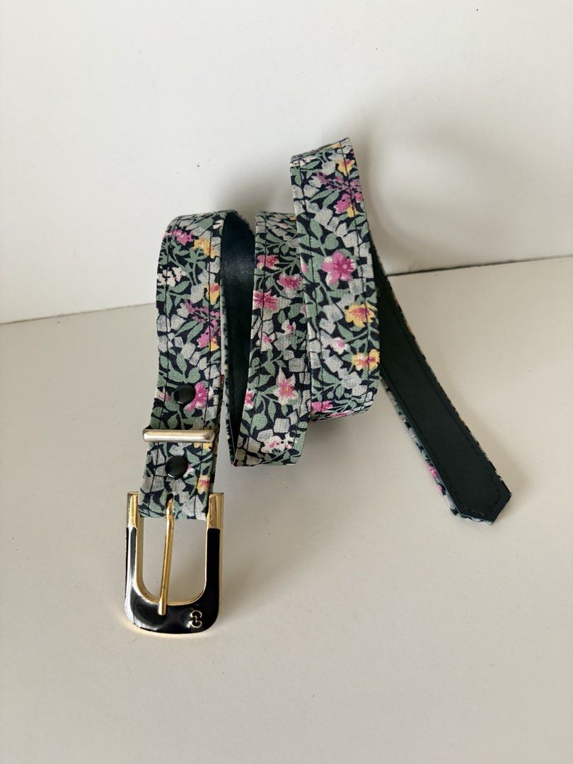 10. Dark Blue Floral Belt (Category: Belts) located in Quezon City. Submitted by wagwagan_ukay_blues (Listing ID 1466236808, Image 1). Description: From Japan In good condition Please expect signs of usage Hole Size -26”-29” Overall - 33” Width -.7” Novaliches Qc.