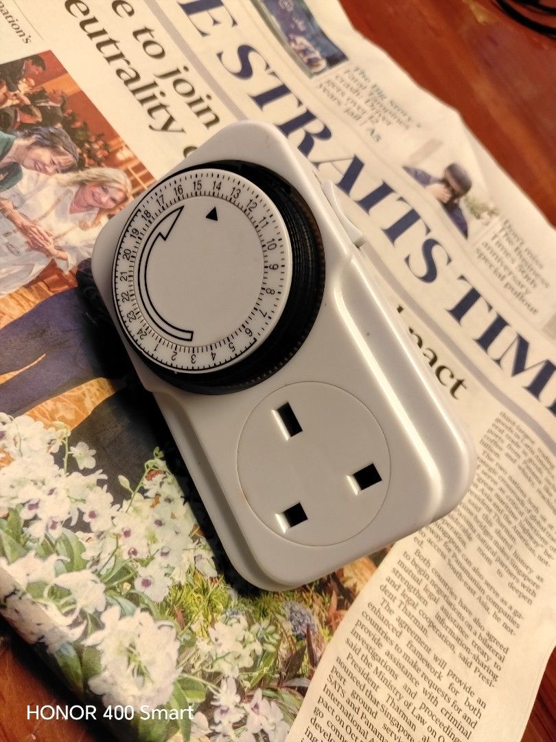 24 Hours Time Switch Mechanical Plug Socket Timer (Category: Electrical, Adaptors & Sockets) located in Singapore. Submitted by valueformoney123 (Listing ID 1466248575, Image 1). Description: - Type: Mechanical 24-hour time switch plug - Plug: Standard 3-pin British configuration - Control: Side override switch with timer icon - Specs: 250V ~ 50Hz, 13(2)A, BS CE certified - Ideal for: Automating lamps, fans, and household appliances.