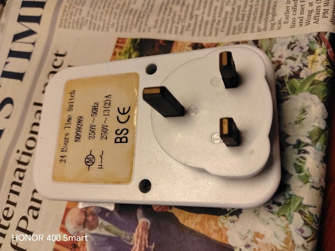 24 Hours Time Switch Mechanical Plug Socket Timer (Category: Electrical, Adaptors & Sockets) located in Singapore. Submitted by valueformoney123 (Listing ID 1466248575, Image 2). Description: - Type: Mechanical 24-hour time switch plug - Plug: Standard 3-pin British configuration - Control: Side override switch with timer icon - Specs: 250V ~ 50Hz, 13(2)A, BS CE certified - Ideal for: Automating lamps, fans, and household appliances.