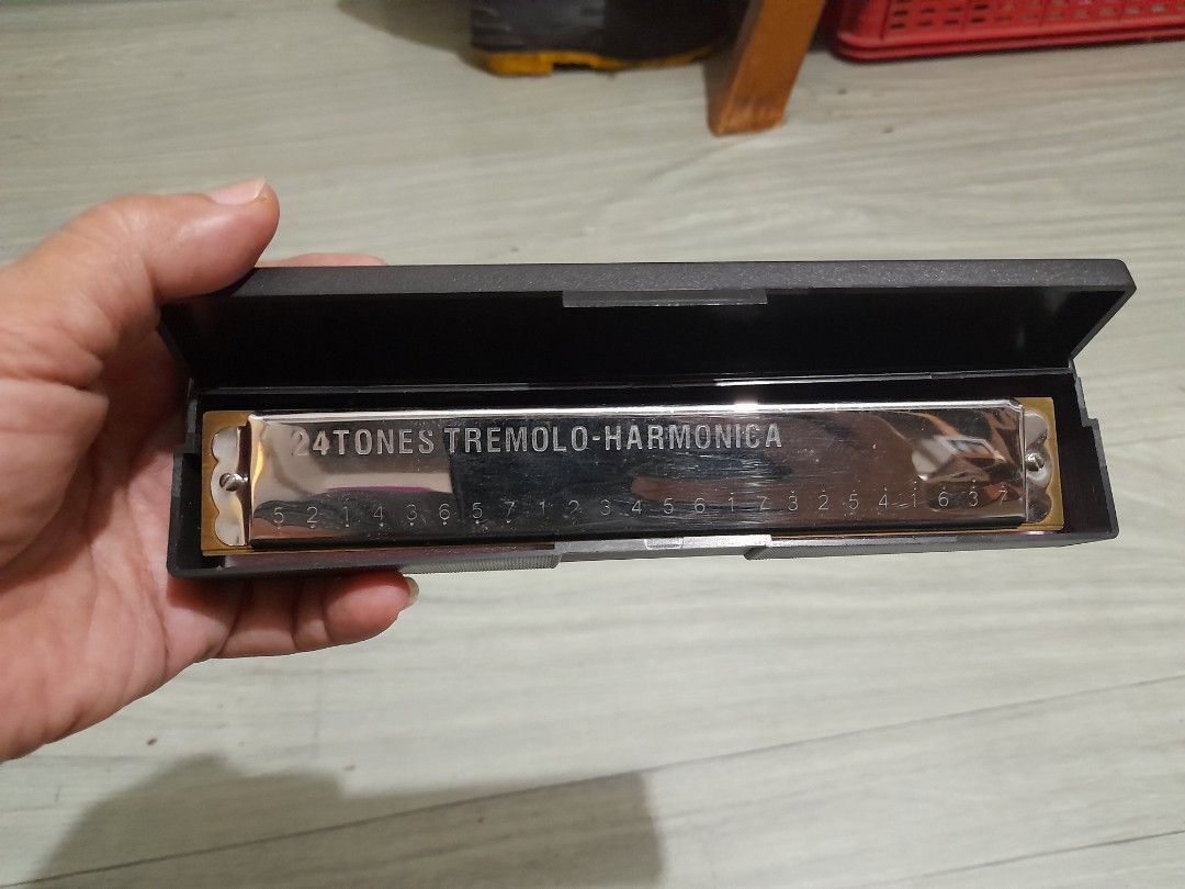 24 Tones Tremolo Harmonica with Hard Case (Category: Musical Instruments) located in Bocaue. Submitted by marajapansurplus (Listing ID 1466175290, Image 3). Description: - 24-tone tremolo harmonica with a sleek chrome-plated finish - Includes original black hardshell case with a vibrant pink interior lining - Clean surface with only minor reflection marks from handling - Fully tested and ready to play or display - Ships securely from a trusted se