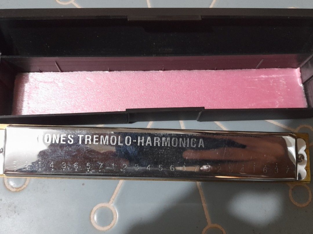 24 Tones Tremolo Harmonica with Hard Case (Category: Musical Instruments) located in Bocaue. Submitted by marajapansurplus (Listing ID 1466175290, Image 1). Description: - 24-tone tremolo harmonica with a sleek chrome-plated finish - Includes original black hardshell case with a vibrant pink interior lining - Clean surface with only minor reflection marks from handling - Fully tested and ready to play or display - Ships securely from a trusted se