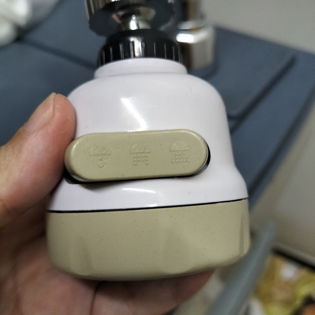 3-Mode Kitchen Faucet Sprayer Head Water Saver (Category: Bathroom & Kitchen Fixtures) located in Paranaque City. Submitted by decluttering-all (Listing ID 1466243917, Image 2). Description: - 3 water flow modes easily controlled by a side toggle switch - White and beige body with a sleek stainless steel spray face - Standard threaded connector designed to fit most kitchen taps - Tested and 100% working properly - Easy to install, perfect kitchen