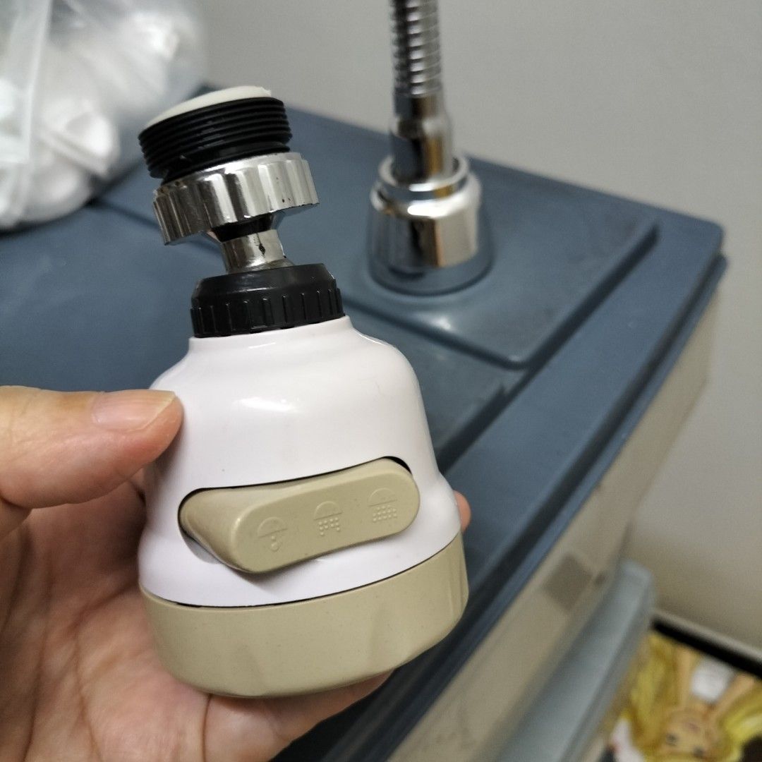 3-Mode Kitchen Faucet Sprayer Head Water Saver (Category: Bathroom & Kitchen Fixtures) located in Paranaque City. Submitted by decluttering-all (Listing ID 1466243917, Image 3). Description: - 3 water flow modes easily controlled by a side toggle switch - White and beige body with a sleek stainless steel spray face - Standard threaded connector designed to fit most kitchen taps - Tested and 100% working properly - Easy to install, perfect kitchen