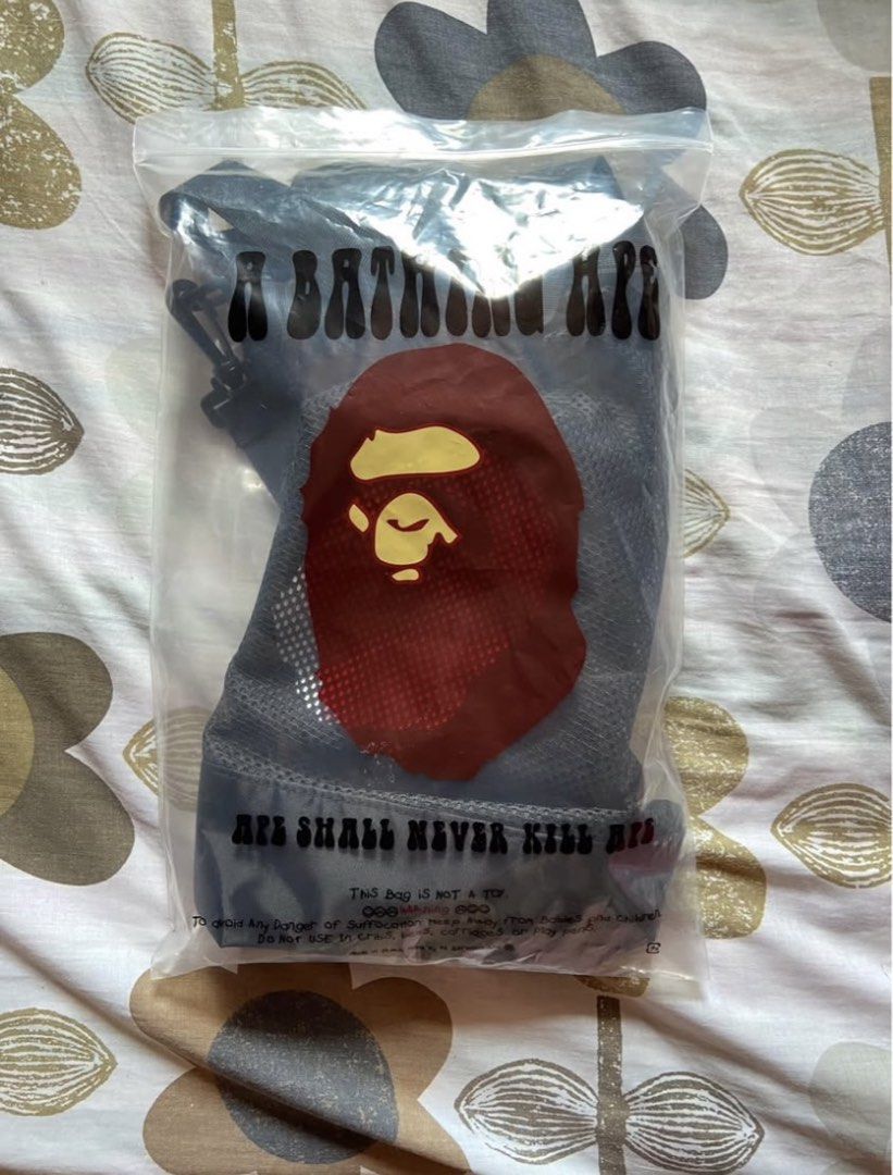 A Bathing Ape BAPE Black Mesh Tote Bag (Category: Tote Bags) located in Makati City. Submitted by ellope (Listing ID 1466264387, Image 3). Description: Authentic BAPE black mesh tote bag featuring the iconic Ape head logo. Measures 16" x 16" and comes with dual handles, an adjustable strap, a matching dust bag, and original packaging..
