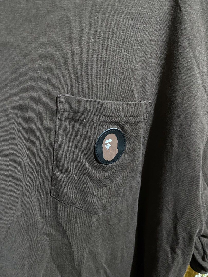 A Bathing Ape Pocket Tee Brown Size XL (Category: Tshirts & Polo Shirts ) located in Imus. Submitted by frootiloots4103 (Listing ID 1466208288, Image 2). Description: - Brand: A Bathing Ape (BAPE) - Color: Brown - Size: XL (Measurements: 22" x 28") - Material: Cotton - Details: Ape head logo patch on chest pocket - Condition: Clean, graphics intact, classic streetwear staple OPEN FOR NEGO (best if aspack) 📍Imus, Cavite 4103 Can do meetups within