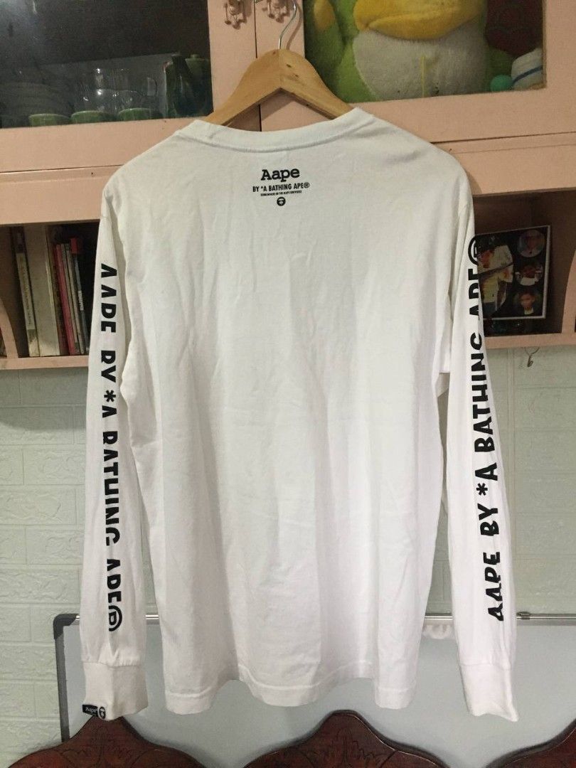 Aape By A Bathing Ape Long Sleeves 💎 (Category: Coats, Jackets and Outerwear) located in Tuguegarao City. Submitted by dip_thrifts (Listing ID 1466219334, Image 2). Description: Aape By A Bathing Ape Long Sleeves 💎 21 width × 28 length Best fit medium 9.5/10 color rate or better 9.5/10 condition or better Tight ribbings and neckline Complete tags No issue.