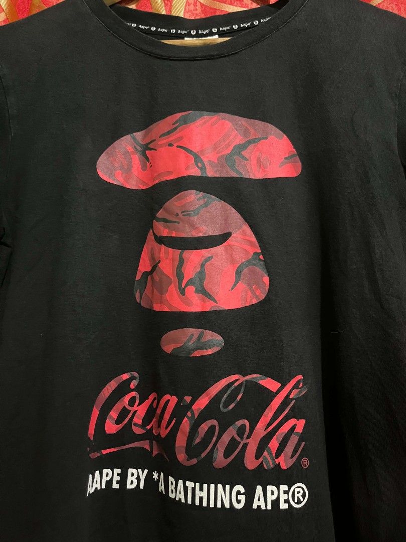 Aape x Coca Cola (Category: Tshirts & Polo Shirts ) located in Surigao. Submitted by nico_nicc (Listing ID 1466306001, Image 3). Description: 📐Dimes: 19x25.5 ❗Issue: Hairlines, need wash 📌Color may vary due to lighting 📌 Item is thrifted, manage your expectations. 📍MOP: GCASH (PAYMENT FIRST) 🚛COURIER: J&T ❗STRICTLY NO REFUND 1️⃣ NEGOTIABLE 💸PRICE: 450+sf.