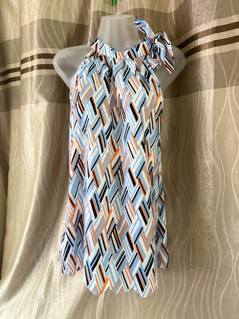 Abstract Print Halter Tunic Top (Category: Sleeveless) located in Caloocan City. Submitted by lovedbyzee (Listing ID 1466280886, Image 2). Description: ₊˚⊹♡ ➔ Brand: Boutique ₊˚⊹♡ ➔ Size: Plus Size ₊˚⊹♡ ➔ Lightweight short-sleeve top featuring a bold abstract brushstroke pattern in blue, white, and black, a flattering round neckline with a small front keyhole cut-out, and a comfortable relaxed fit. ₊˚⊹♡ ➔ Condition: Excellent brand new condition!