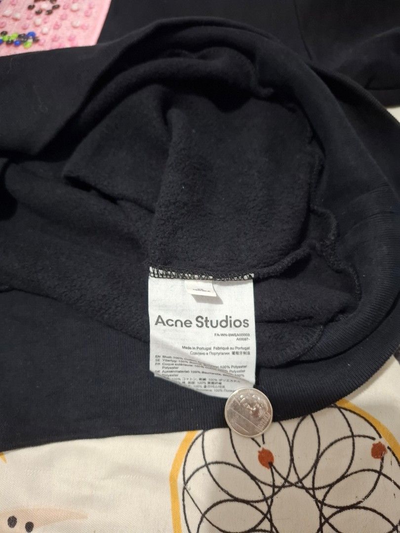 Acne Studios Black Sweatshirt with Pink Beaded Patch (Category: Longsleeves) located in Mandaue City. Submitted by lootr (Listing ID 1466276775, Image 2). Description: - Brand: Acne Studios - Style: Black crewneck sweatshirt with classic minimalist fit - Details: Signature square pink chest patch with colorful beaded detailing - Material: 100% cotton shell with ultra-soft fleece lining inside - Comfort: Ribbed collar, cuffs, and hem for extra war