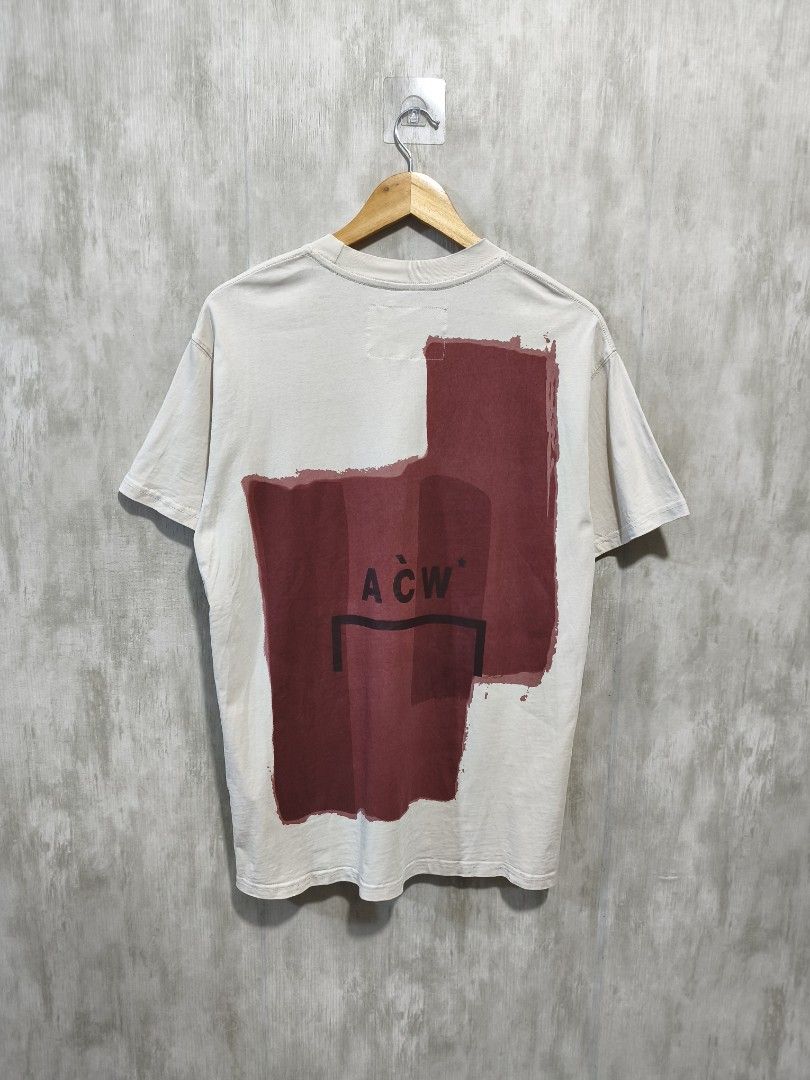 A-COLD-WALL PAINT TEE (Category: Activewear) located in Santiago. Submitted by dc_daily_thrift (Listing ID 1466309191, Image 2). Description: - Brand: A-COLD-WALL* - Item: Paint Tee / Graphic T-Shirt - Size: Medium (M) - Dimensions : 20.5×28.5 - Color: Off-white / Cream with burgundy painted block graphics - Design: Unique painted block print on front and back with ACW branding - Material: 100% Premium Cotton - Origin: Made in Italy - Condition: 