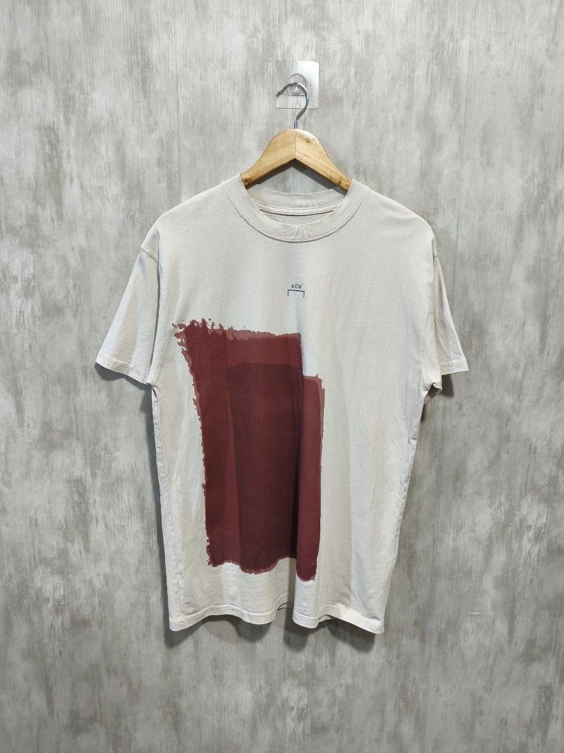 A-COLD-WALL PAINT TEE (Category: Activewear) located in Santiago. Submitted by dc_daily_thrift (Listing ID 1466309191, Image 1). Description: - Brand: A-COLD-WALL* - Item: Paint Tee / Graphic T-Shirt - Size: Medium (M) - Dimensions : 20.5×28.5 - Color: Off-white / Cream with burgundy painted block graphics - Design: Unique painted block print on front and back with ACW branding - Material: 100% Premium Cotton - Origin: Made in Italy - Condition: 