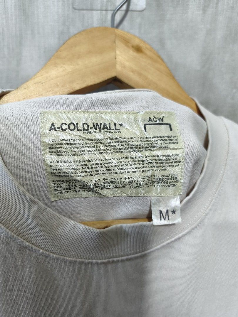 A-COLD-WALL PAINT TEE (Category: Activewear) located in Santiago. Submitted by dc_daily_thrift (Listing ID 1466309191, Image 3). Description: - Brand: A-COLD-WALL* - Item: Paint Tee / Graphic T-Shirt - Size: Medium (M) - Dimensions : 20.5×28.5 - Color: Off-white / Cream with burgundy painted block graphics - Design: Unique painted block print on front and back with ACW branding - Material: 100% Premium Cotton - Origin: Made in Italy - Condition: 