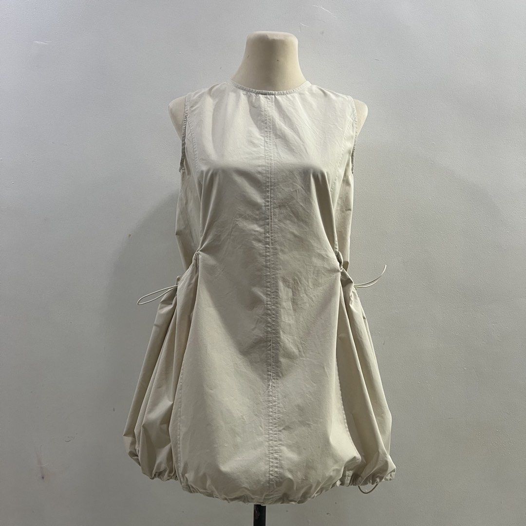 acubi cargo bubble mini dress (Category: Dresses) located in Malabon City. Submitted by minidressmonster (Listing ID 1466222826, Image 1). Description: beige acubi cargo bubble mini dress best fit xs-s preloved so please manage your expectations bawal sa maselan see last pic for flaw: oil stains, unsure if kaya matanggal.