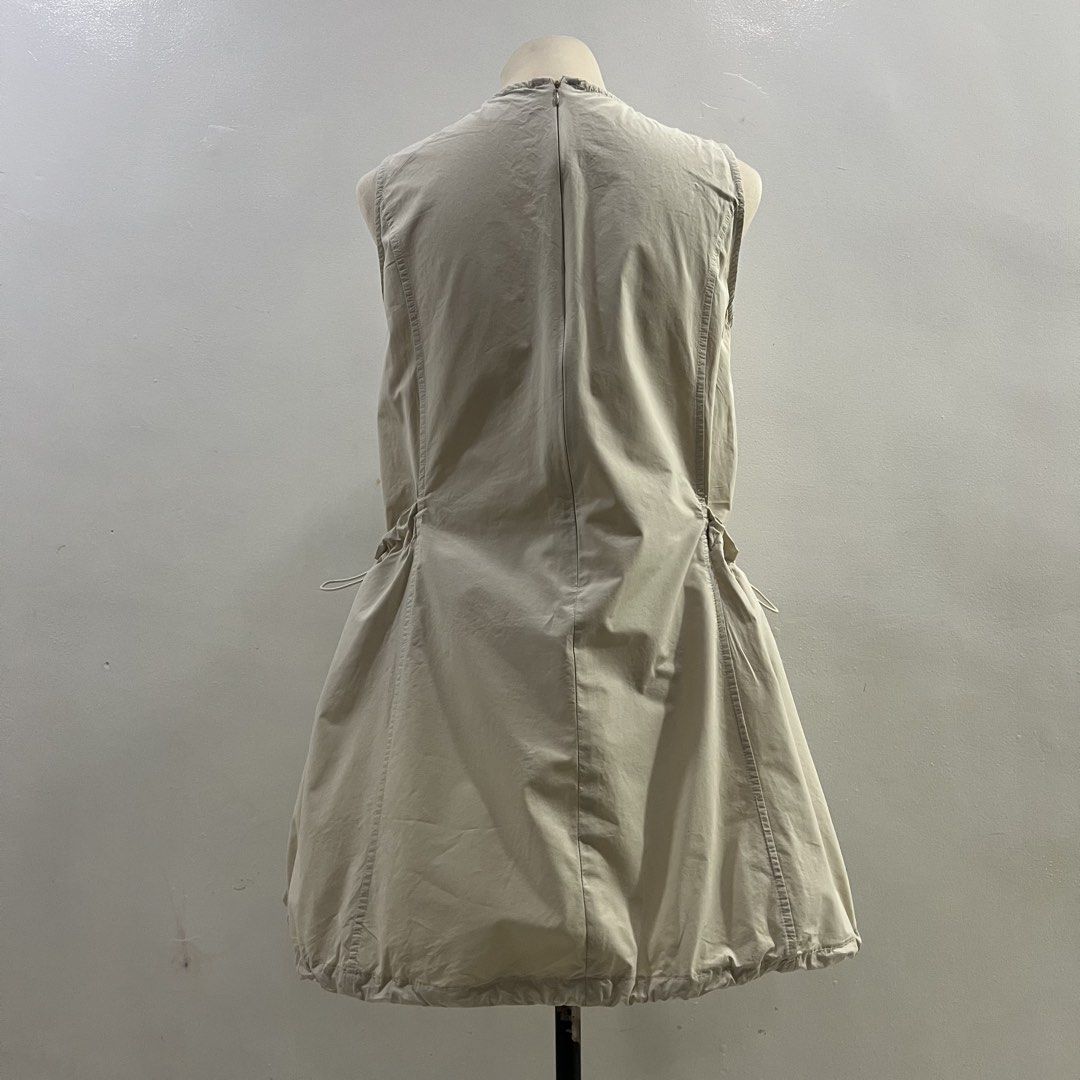 acubi cargo bubble mini dress (Category: Dresses) located in Malabon City. Submitted by minidressmonster (Listing ID 1466222826, Image 3). Description: beige acubi cargo bubble mini dress best fit xs-s preloved so please manage your expectations bawal sa maselan see last pic for flaw: oil stains, unsure if kaya matanggal.