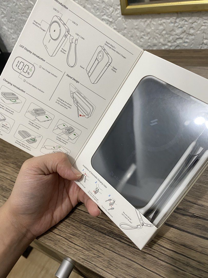 ADAM ELEMENTS POWERBANK (Category: Batteries & Power Banks) located in Mandaluyong City. Submitted by beccaaaaw (Listing ID 1466285298, Image 2). Description: - Brand: Adam Elements - Model: Vionta C2 Pro 8-in-1 Wireless Power Bank - Color: Midnight - Battery Capacity: 10000mAh - Condition: Brand new in box - Key Features: Magnetic wireless charging compatible with iPhones, Apple Watch, and Samsung Galaxy Watch - Extra Features: Built-in flip sta