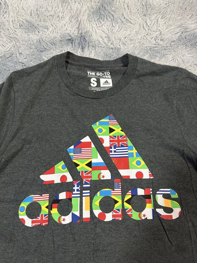 Adidas 3 Stripes Flag Tee (Category: Tshirts & Polo Shirts ) located in Baao. Submitted by revamped.co (Listing ID 1466251967, Image 2). Description: Adidas 3 Stripes Flag Tee Excellent Condition Size Small on Tag 18 by 27 Inches No Issue.