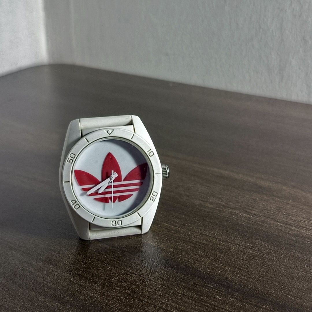 Adidas ADH2980 Watch (Category: Men's Watches) located in Antipolo. Submitted by soon2byours_ (Listing ID 1466075899, Image 2). Description: - Authentic Adidas ADH2820 watch - Clean white design with striking red Trefoil logo on dial - Durable and comfortable white silicone strap with secure steel buckle - Features the Adidas logo engraved on the crown - Great everyday casual or streetwear accessory.