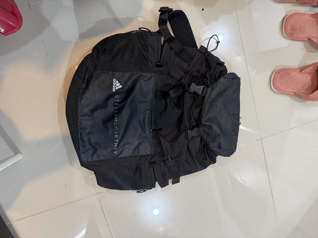 Adidas by Stella McCartney Backpack Black (Category: Backpacks) located in Quezon City. Submitted by klosetanijana (Listing ID 1466272315, Image 3). Description: - Authentic Adidas by Stella McCartney black backpack - Secure drawstring main compartment with buckled top flap - Convenient side mesh pockets for water bottles - Front zip pocket with Adidas by Stella McCartney branding - Comfortable adjustable shoulder straps and top handle - Flaw not