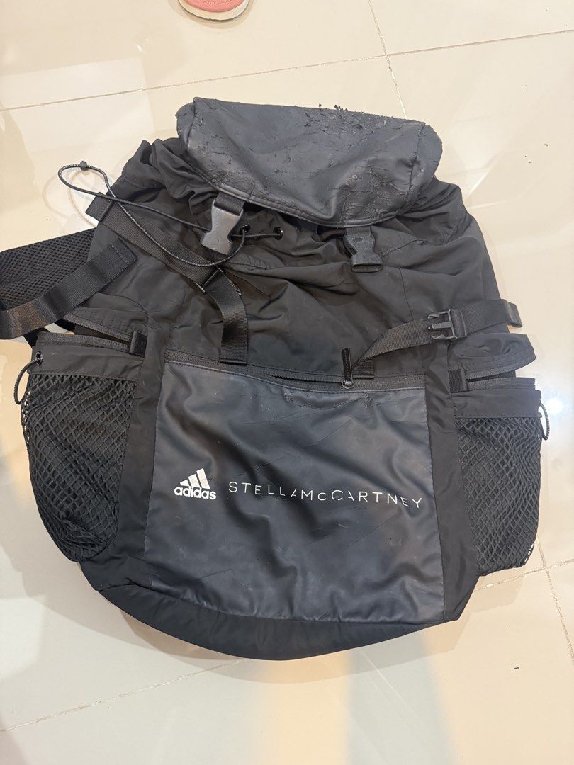 Adidas by Stella McCartney Backpack Black (Category: Backpacks) located in Quezon City. Submitted by klosetanijana (Listing ID 1466272315, Image 1). Description: - Authentic Adidas by Stella McCartney black backpack - Secure drawstring main compartment with buckled top flap - Convenient side mesh pockets for water bottles - Front zip pocket with Adidas by Stella McCartney branding - Comfortable adjustable shoulder straps and top handle - Flaw not
