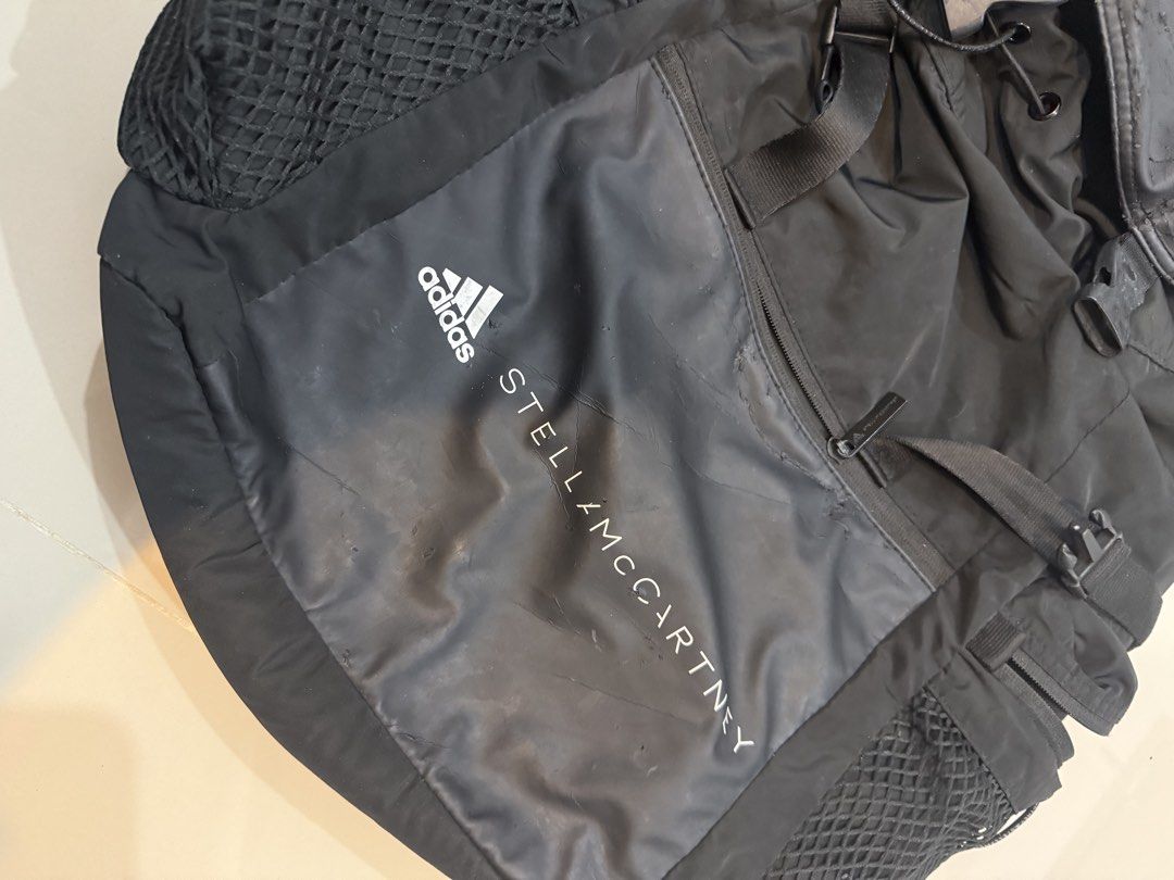 Adidas by Stella McCartney Backpack Black (Category: Backpacks) located in Quezon City. Submitted by klosetanijana (Listing ID 1466272315, Image 2). Description: - Authentic Adidas by Stella McCartney black backpack - Secure drawstring main compartment with buckled top flap - Convenient side mesh pockets for water bottles - Front zip pocket with Adidas by Stella McCartney branding - Comfortable adjustable shoulder straps and top handle - Flaw not
