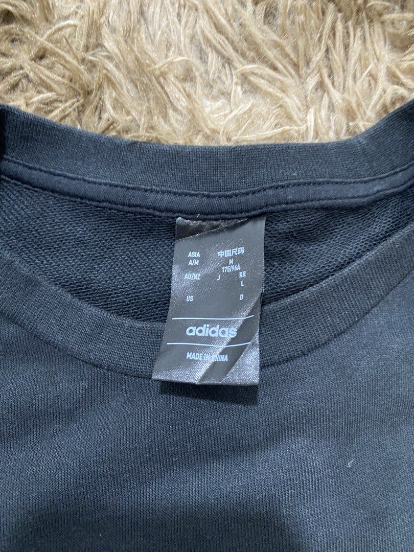 Adidas E 3S Crew FT Sweatshirt Black Size M (Category: Coats, Jackets and Outerwear) located in Cagayan de Oro. Submitted by sepamorash53558 (Listing ID 1466328804, Image 3). Description: - Brand: Adidas - Style: Crewneck sweatshirt - Color: Black with classic white three stripes - Size: Medium (M) - Material: 70% cotton, 30% polyester - Details: Small white Adidas logo on left chest, ribbed cuffs and hem - Condition: Clean and ready to wear.