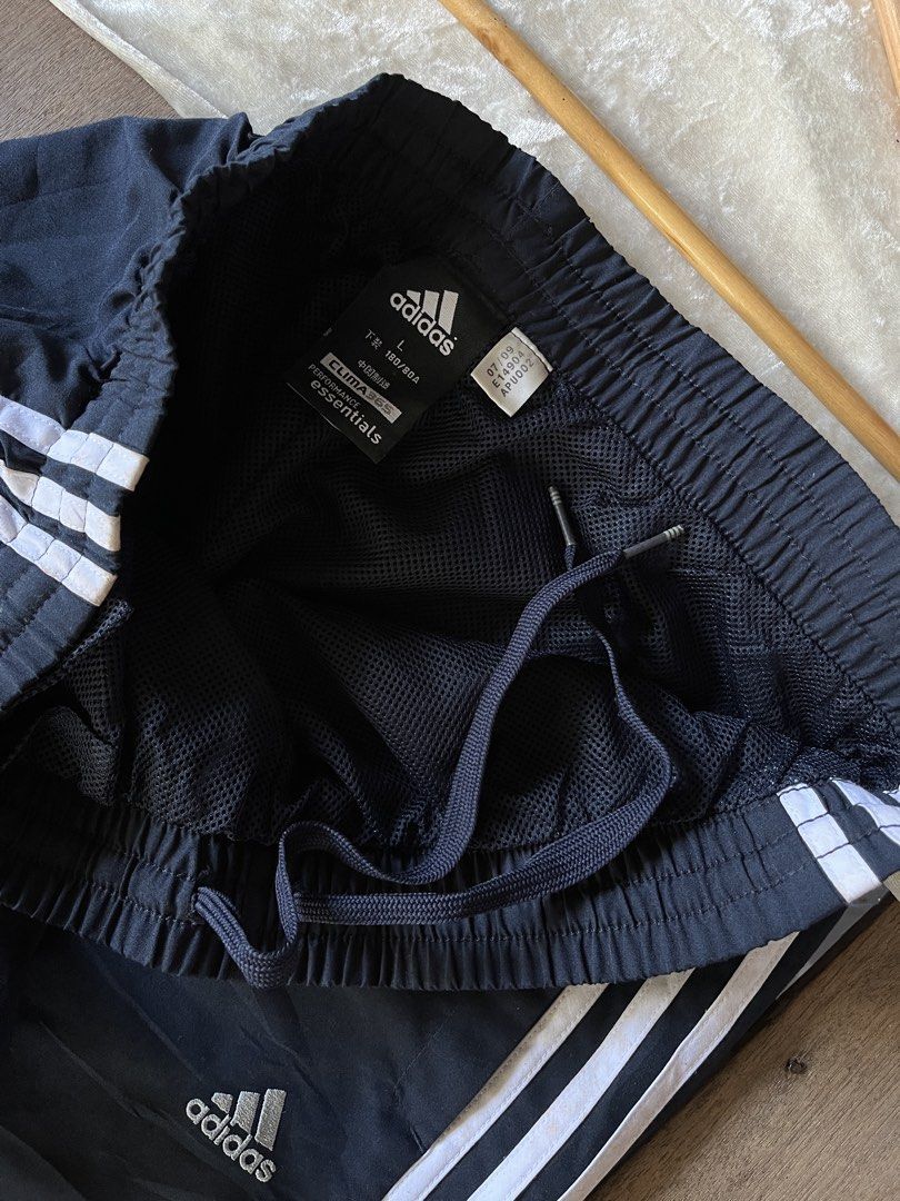 ADIDAS ESSENTIALS (Category: Joggers) located in Santiago. Submitted by justineolshp (Listing ID 1466244911, Image 2). Description: Adidas Essentials 3-Stripes Pants size Large on tag | 30-36 waist 41 length via tape measure Issue: Stains (pls see last pics) 10/10 color rate.