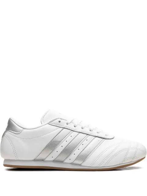 Adidas Taekwondo Cloud White/ Silver (Category: Sneakers) located in Taguig. Submitted by siyelamaree (Listing ID 1466274691, Image 2). Description: - Design: Metallic silver stripes and matching heel tab with stitched toe caps - Soles: Vintage-vibes gum rubber outsoles - Condition: Minor leather creasing and light sole scuffing from normal wear - Closure: Classic lace-up style no heel drags, intact leather - just need cleaning :) .