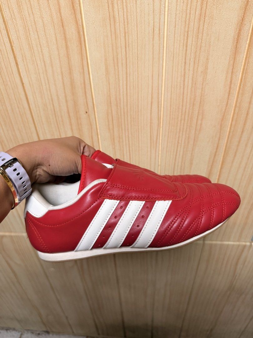 Adidas Taekwondo womens (Category: Sneakers) located in Davao. Submitted by cloie12345 (Listing ID 1466223979, Image 1). Description: Bright red Adidas sneakers in US 6.5 / UK 5 / FR 38. Features white stripes, lace cover flap, and gum soles. Clean condition with minor sole wear..