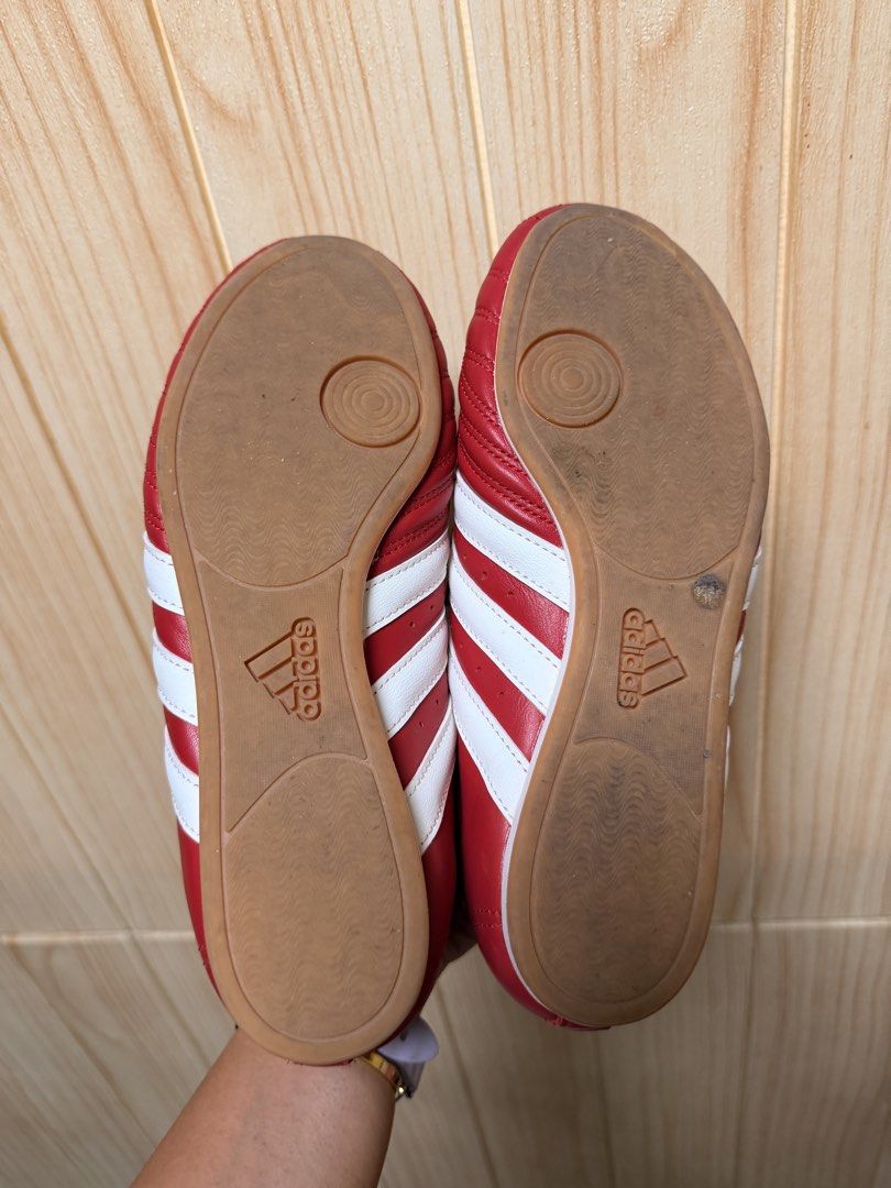 Adidas Taekwondo womens (Category: Sneakers) located in Davao. Submitted by cloie12345 (Listing ID 1466223979, Image 3). Description: Bright red Adidas sneakers in US 6.5 / UK 5 / FR 38. Features white stripes, lace cover flap, and gum soles. Clean condition with minor sole wear..