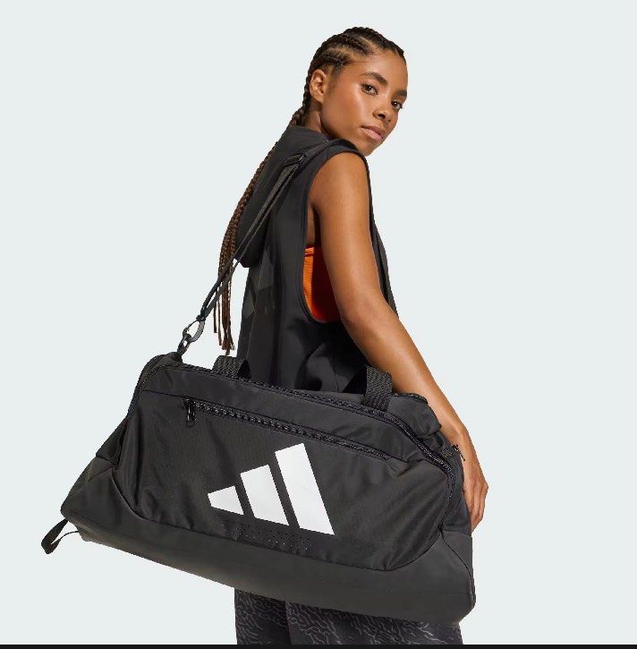 Adidas Training Defense Duffel Bag Medium Black (Category: Sling Bags) located in Manila. Submitted by whenn_1985 (Listing ID 1466288309, Image 1). Description: - Brand new with retail tag (2,000 PHP value) still in original plastic packaging - Color: Classic black with white Adidas logo on the front - Size: Medium, perfect for gym and training gear - Storage: Multiple zippered compartments to keep your items organized - Comfort & Durability: Stu