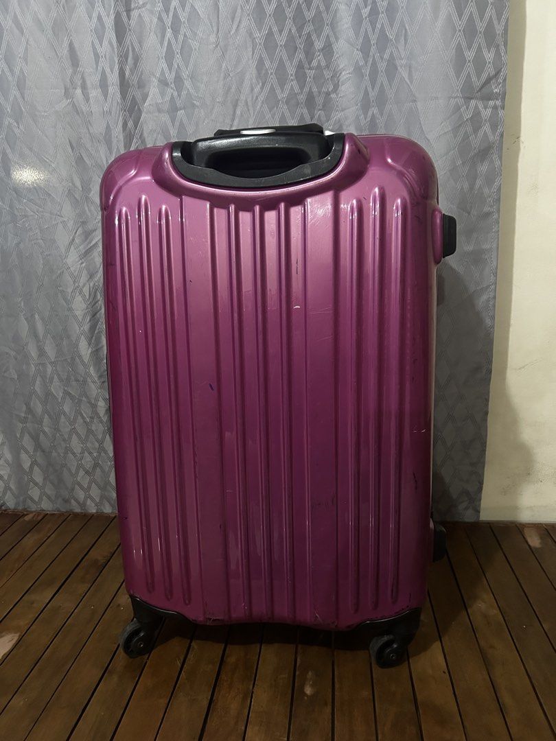 AEON TOPVALU Luggage Spinner Suitcase (Category: Luggage) located in Taguig. Submitted by ghiebow06 (Listing ID 1466229722, Image 3). Description: - Vibrant bright pink hardshell luggage with stylish silver trim - Smooth 360-degree spinner wheels for effortless rolling - Secure built-in combination lock with key for peace of mind - Retractable top handle with comfortable grip and convenient side carry handle - Exterior shows normal scuffs and mar