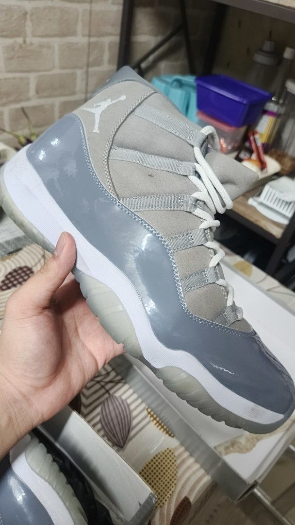 Air Jordan 11 Retro Cool Grey (Category: Sneakers) located in Manila. Submitted by almanzakie00206 (Listing ID 1466296664, Image 1). Description: - Model: Air Jordan 11 Retro (Cool Grey & White) - Design: Classic patent leather mudguard with premium grey nubuck panels - Soles: Clean white midsole paired with an icy translucent outsole - Branding: Signature Jumpman logo on the heel and insoles - Inclusions: Original box and extra laces included - 