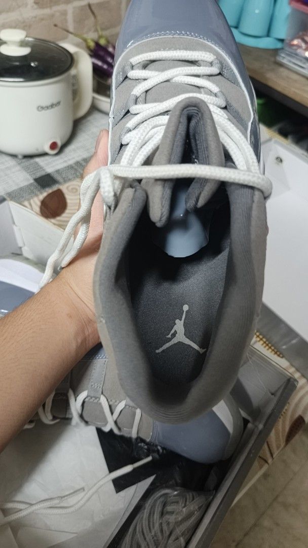 Air Jordan 11 Retro Cool Grey (Category: Sneakers) located in Manila. Submitted by almanzakie00206 (Listing ID 1466296664, Image 2). Description: - Model: Air Jordan 11 Retro (Cool Grey & White) - Design: Classic patent leather mudguard with premium grey nubuck panels - Soles: Clean white midsole paired with an icy translucent outsole - Branding: Signature Jumpman logo on the heel and insoles - Inclusions: Original box and extra laces included - 