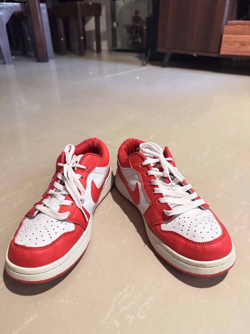 Air Jordan 1 Low Red White (Category: Sneakers) located in Manila. Submitted by mysticdog_8e9243 (Listing ID 1466182249, Image 2). Description: - Brand: Air Jordan 1 Low - Colorway: Classic Red and White - Material: White leather base with red leather overlays and matching red swoosh - Details: Iconic embroidered winged basketball logo on the heel - Soles: Clean with minimal wear as shown in pictures - Fit: Standard sizing, size tag located insid